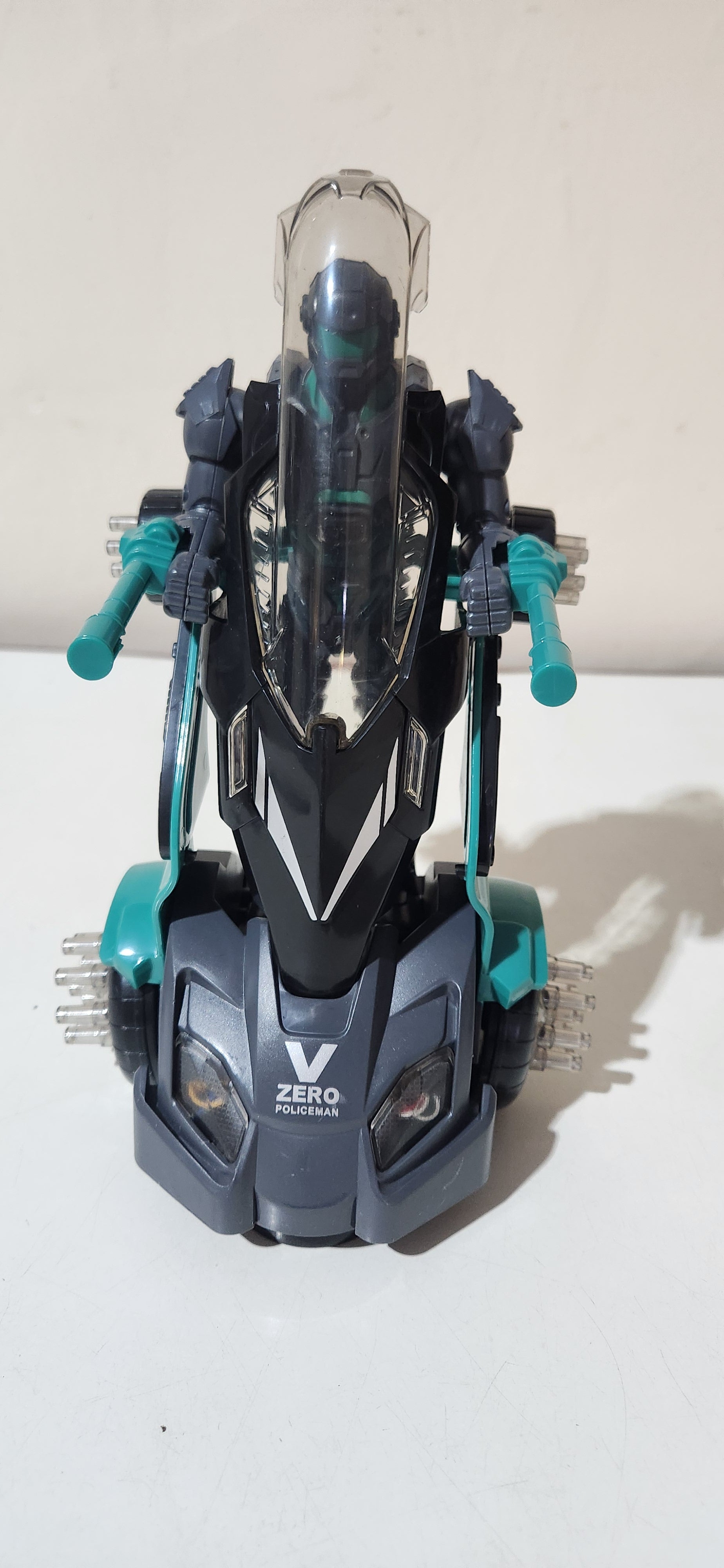 Robô de brinquedo policial com luz e som cinza