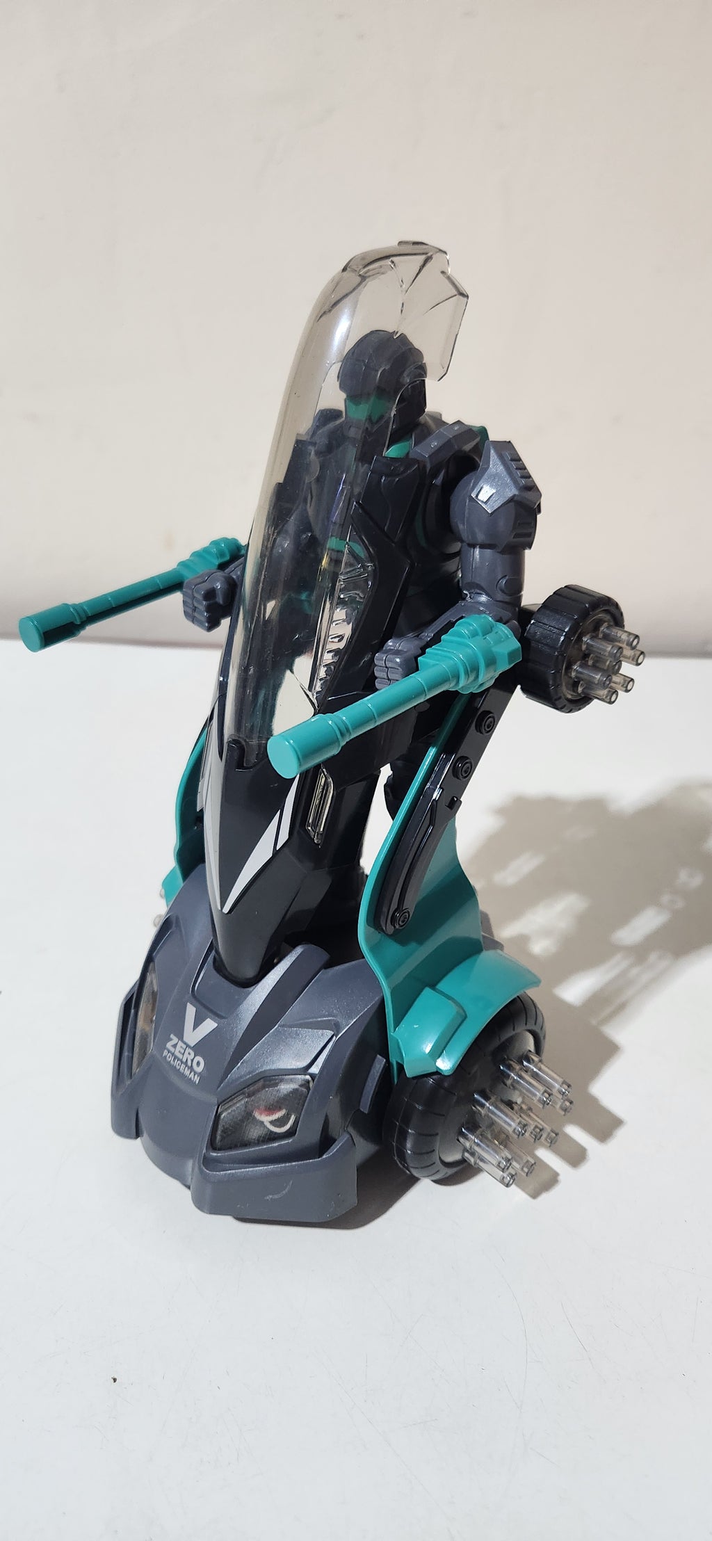 Robô de brinquedo policial com luz e som cinza